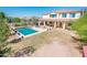 Inviting backyard featuring a sparkling pool and a covered patio perfect for outdoor entertaining and leisure at 4836 S Covalent Ln, Mesa, AZ 85212
