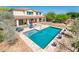 Beautiful backyard with a sparkling pool, covered patio, and ample space for outdoor enjoyment at 4836 S Covalent Ln, Mesa, AZ 85212