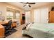 Neutral bedroom with lots of natural light, work space, and sliding closet doors at 4836 S Covalent Ln, Mesa, AZ 85212