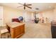 A spacious bonus room with neutral tones provides lots of natural light and has an open feel at 4836 S Covalent Ln, Mesa, AZ 85212