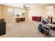 An open and spacious bonus room area is great for hobbies with lots of natural light and neutral tones at 4836 S Covalent Ln, Mesa, AZ 85212