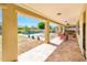 Covered patio offering a view of the backyard pool and lounge area, ideal for relaxation and entertainment at 4836 S Covalent Ln, Mesa, AZ 85212