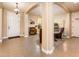 Welcoming foyer featuring arched entryways, tile flooring, and a glimpse into the adjacent living spaces at 4836 S Covalent Ln, Mesa, AZ 85212