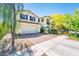 Charming two-story home boasts a two-car garage, landscaped yard, and inviting curb appeal at 4836 S Covalent Ln, Mesa, AZ 85212