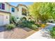 View of home showing well-maintained landscaping including lush plants and walkway to front door at 4836 S Covalent Ln, Mesa, AZ 85212