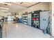 Organized garage with custom cabinets, room for vehicles, and ample storage space for tools and equipment at 4836 S Covalent Ln, Mesa, AZ 85212