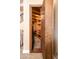 Secret room behind a bookcase with wood beams and framing, adjacent to the stairs at 4836 S Covalent Ln, Mesa, AZ 85212