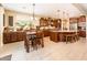 Spacious kitchen with dining area offers generous counter space, modern appliances, and tiled floors at 4836 S Covalent Ln, Mesa, AZ 85212