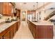 Open-concept kitchen featuring a large island, stainless steel appliances, and granite countertops at 4836 S Covalent Ln, Mesa, AZ 85212