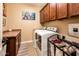 The laundry room includes a washer, dryer, storage cabinets, and a laundry sink at 4836 S Covalent Ln, Mesa, AZ 85212