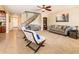 Inviting living room with comfortable seating, a staircase, and an open layout to the foyer at 4836 S Covalent Ln, Mesa, AZ 85212