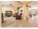Open-concept space with sitting area that leads to a living room, featuring columns and arched entryways at 4836 S Covalent Ln, Mesa, AZ 85212