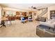 Expansive living room open to the kitchen and dining area, offering ample space for entertaining at 4836 S Covalent Ln, Mesa, AZ 85212
