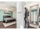 Bedroom leads into closet with built in shelves and a door to the outside at 5025 N 20Th Ave, Phoenix, AZ 85015