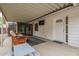 Inviting covered patio with outdoor seating, a picnic table, and a sliding glass door, perfect for outdoor relaxation at 5025 N 20Th Ave, Phoenix, AZ 85015