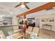 Dining area with a glass table and chairs leading to a cozy living space at 5025 N 20Th Ave, Phoenix, AZ 85015