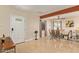Bright entryway with tile floors, a decorative front door, and dining area at 5025 N 20Th Ave, Phoenix, AZ 85015