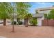 Exterior view of a cozy home with a xeriscaped front yard and mature landscaping at 5025 N 20Th Ave, Phoenix, AZ 85015