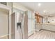 Stainless steel refrigerator and cabinets with view into open living area at 5025 N 20Th Ave, Phoenix, AZ 85015