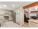 Open kitchen features stainless steel appliances and transitions seamlessly into an adjacent living space at 5025 N 20Th Ave, Phoenix, AZ 85015