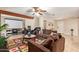 Comfortable living room with plush brown sofas, projector screen, and tile floors at 5025 N 20Th Ave, Phoenix, AZ 85015