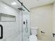 Bathroom featuring glass shower with hexagon tile, white subway tile, and black hardware at 5124 N 31St Pl # 522, Phoenix, AZ 85016