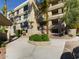Exterior shot of condo building with landscaping, carport, and multiple levels of balconies at 5124 N 31St Pl # 522, Phoenix, AZ 85016