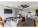 Open-concept living space featuring modern decor, wood floors, a ceiling fan, and stylish furnishings at 5124 N 31St Pl # 522, Phoenix, AZ 85016