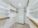 Spacious walk-in closet with custom shelving, drawers, and ample hanging space offers great storage solutions at 5124 N 31St Pl # 522, Phoenix, AZ 85016