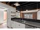 Well-lit kitchen with stainless steel sink, white cabinets, and open design at 5621 N 79Th St, Scottsdale, AZ 85250