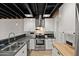 Kitchen with stainless steel appliances, white cabinets, and modern countertops at 5621 N 79Th St, Scottsdale, AZ 85250