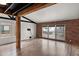 Bright living room with wood beam features, brick walls, and hardwood floors at 5621 N 79Th St, Scottsdale, AZ 85250