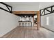 Spacious living area with a bar, beam ceilings, and hardwood floors at 5621 N 79Th St, Scottsdale, AZ 85250