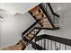 Unique staircase with wooden steps and a black metal railing creating an open passage at 5621 N 79Th St, Scottsdale, AZ 85250