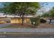 Charming single-story home with a well-manicured front yard and mature landscaping at 607 E Holmes Ave, Mesa, AZ 85204