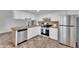 Well-appointed kitchen with granite countertops, stainless steel appliances, and ample cabinetry at 607 E Holmes Ave, Mesa, AZ 85204