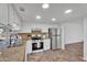 Well-appointed kitchen with granite countertops, stainless steel appliances, and ample cabinetry at 607 E Holmes Ave, Mesa, AZ 85204