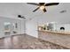 Open-concept layout with a kitchen island, tile flooring, and access to the backyard at 607 E Holmes Ave, Mesa, AZ 85204