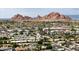 Stunning aerial view showcasing the neighborhood, and the iconic landmark Camelback Mountain at 6206 E Avalon Dr, Scottsdale, AZ 85251