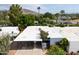 Aerial shot showing a home's roof and a beautiful overview of surrounding trees and neighborhoods at 6206 E Avalon Dr, Scottsdale, AZ 85251