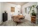 Cozy dining area with modern light fixture, wood table, and views of the outdoors at 6206 E Avalon Dr, Scottsdale, AZ 85251