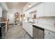Bright kitchen featuring white cabinets, stainless steel appliances, and subway tile backsplash at 6206 E Avalon Dr, Scottsdale, AZ 85251