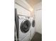 Convenient laundry room featuring modern Samsung washer and dryer and overhead cabinets at 6206 E Avalon Dr, Scottsdale, AZ 85251