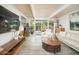 Open living room with bright natural light, sleek tile flooring, and modern decor at 6206 E Avalon Dr, Scottsdale, AZ 85251