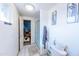 Bathroom with white walls, white tile floors, and a shower at 6445 W Windsor Blvd, Glendale, AZ 85301