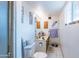 Bathroom with white walls, white tile floors, and a shower at 6445 W Windsor Blvd, Glendale, AZ 85301