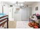 Bright bedroom with closet, work desk, and colorful decor accents at 6445 W Windsor Blvd, Glendale, AZ 85301