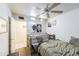 Neutral bedroom featuring a daybed, ceiling fan, and artwork adorning the walls at 6445 W Windsor Blvd, Glendale, AZ 85301