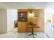 Entryway featuring wood paneling, tile flooring, and decorative light fixture at 6445 W Windsor Blvd, Glendale, AZ 85301