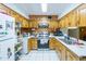 Traditional kitchen featuring wooden cabinets and stainless steel appliances at 6445 W Windsor Blvd, Glendale, AZ 85301